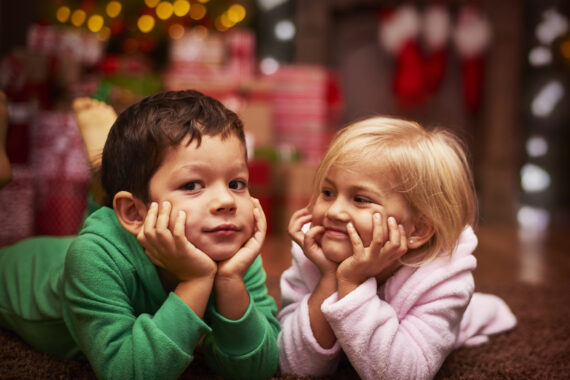 Two preschool-aged children representing the holidays with your preschooler