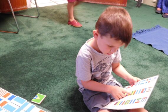Preschooler completes independent schoolwork while practicing Montessori and social distancing